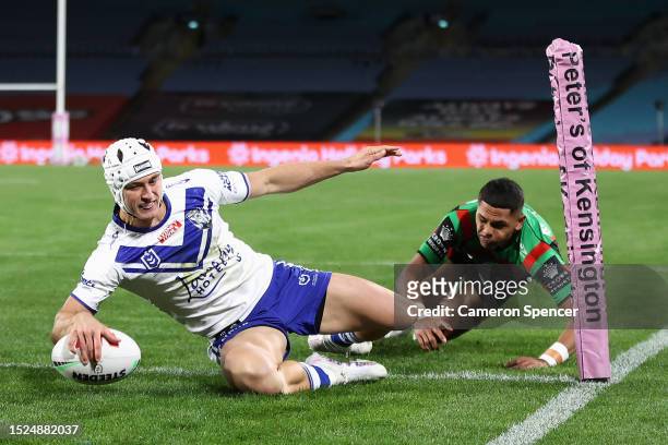 Blake Wilson of the Bulldogs scores a try during the round 19 NRL match between South Sydney Rabbitohs and Canterbury Bulldogs at Accor Stadium on...