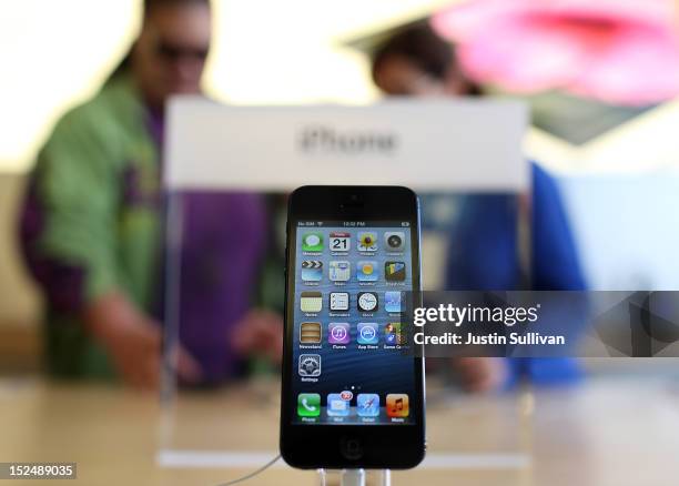 New iPhone 5 is displayed at an Apple Store on September 21, 2012 in San Francisco, California. Customers flocked to Apple Stores across the U.S. To...