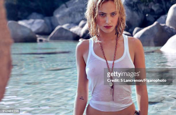Actress Nora Arnezeder poses for Madame Figaro on June 18, 2012 in Corscia, France. Figaro ID:: 103882-024. Tank top by Zadig & Voltaire, necklaces...