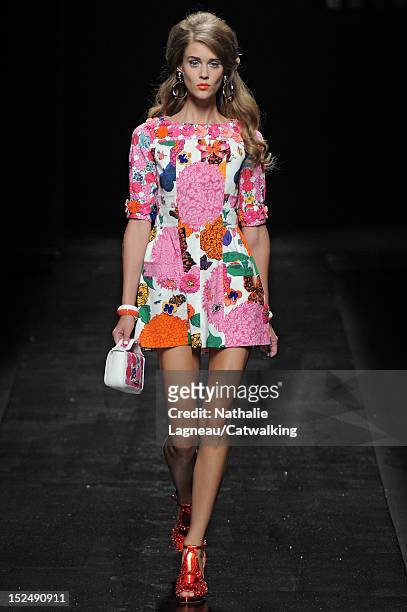 Model walks the runway at the Moschino Spring Summer 2013 fashion show during Milan Fashion Week on September 21, 2012 in Milan, Italy.