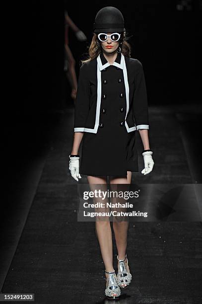 Model walks the runway at the Moschino Spring Summer 2013 fashion show during Milan Fashion Week on September 21, 2012 in Milan, Italy.