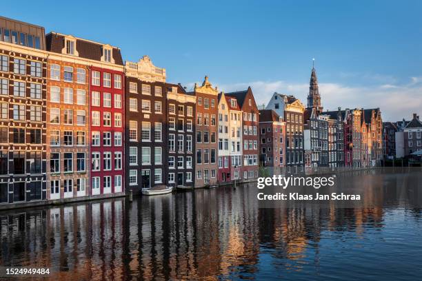 houses at the canal in amsterdam, the netherlands - amsterdam stock pictures, royalty-free photos & images