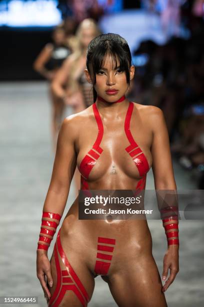 Model walks the runway wearing Black Tape Project during Miami Swim Week Powered By Art Hearts Fashion at Fontainebleau Miami Beach on July 07, 2023...