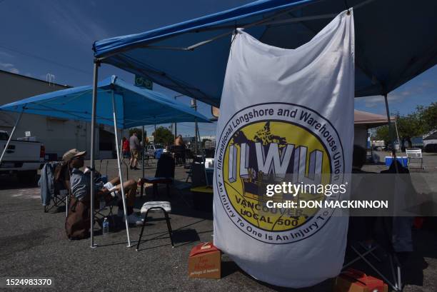 Striking International Longshore and Warehouse Union workers picket in front of the BC Maritime Employees Association Despatch Centre in Vancouver,...