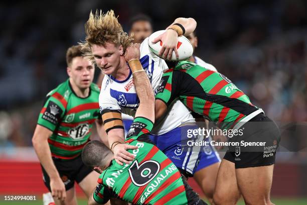 Jacob Preston of the Bulldogs is tackled during the round 19 NRL match between South Sydney Rabbitohs and Canterbury Bulldogs at Accor Stadium on...