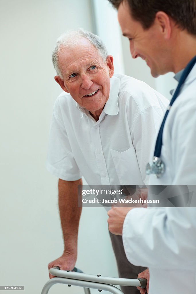 Happy senior man talking to a doctor