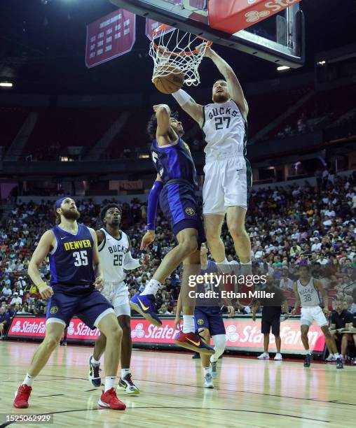 Nico Mannion of the Milwaukee Bucks dunks against Julian Strawther of the Denver Nuggets in the second half of a 2023 NBA Summer League game at the...