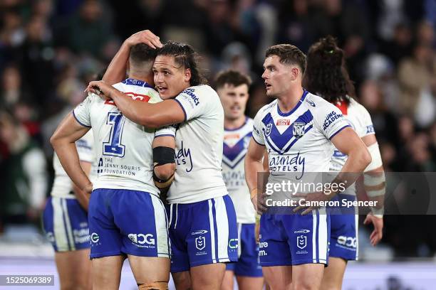 Jake Averillo of the Bulldogs and Jackson Topine of the Bulldogs celebrate winning the round 19 NRL match between South Sydney Rabbitohs and...