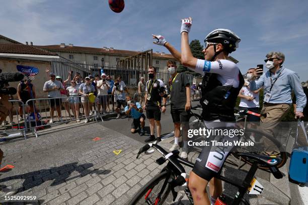 Tadej Pogacar of Slovenia and UAE Team Emirates - White Best Young Rider Jersey plays with a basketball ball prior to the stage eight of the 110th...