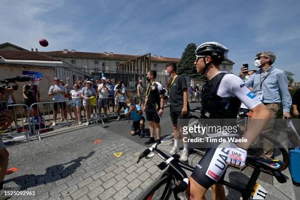 Tadej Pogacar of Slovenia and UAE Team Emirates - White Best Young Rider Jersey plays with a basketball ball prior to the stage eight of the 110th...