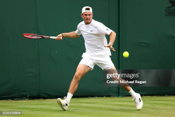 Tommy Paul of United States stretches to play a forehand against Jiri Lehecka of Czech Republic in the Men's Singles third round match during day six...