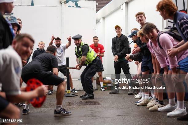 Policeman joins in a game of cricket under the Western Terrace during a rain delayed Day Three of the LV= Insurance Ashes 3rd Test Match between...