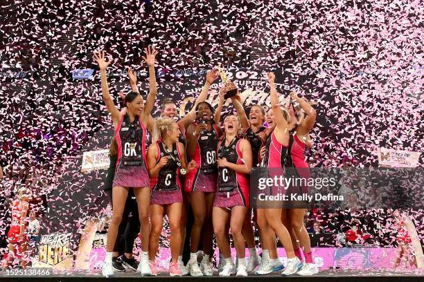 Players of the Thunderbirds celebrate victory with the trophy on stage after during the 2023 Super Netball Grand Final match between Adelaide...