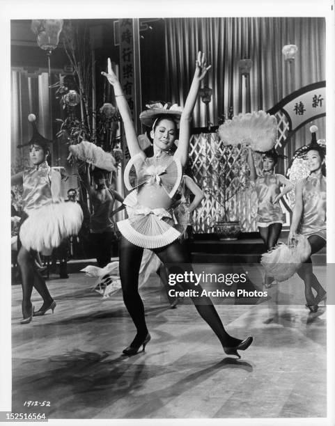 Nancy Kwan dancing in a scene from the film 'Flower Drum Song', 1961.