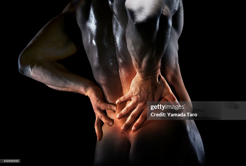 Man's bare back in pain