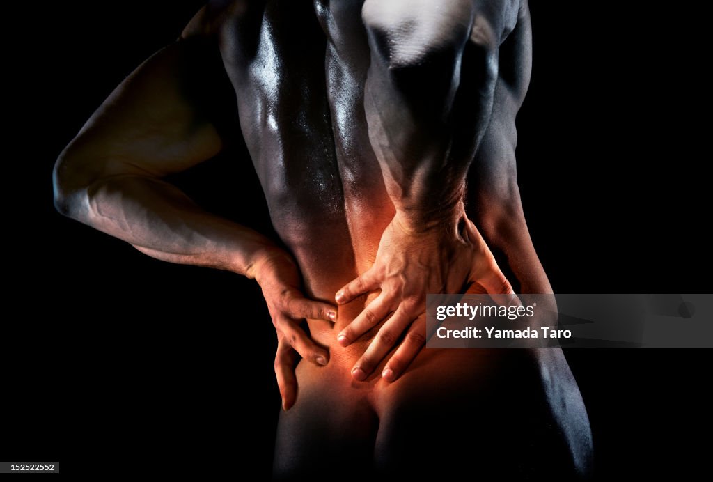 Man's bare back in pain