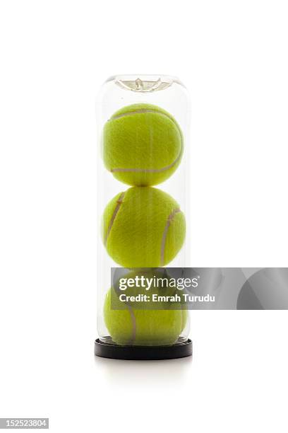 a clear tube of tennis balls - balle de tennis photos et images de collection
