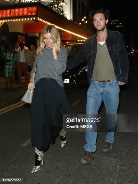 Sienna Miller and Oli Green are seen out and about on July 11, 2023 in London, United Kingdom.