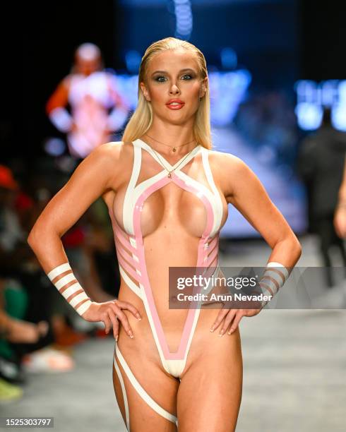 Model walks the runway wearing Black Tape Project during Miami Swim Week Powered by Art Hearts Fashion at Fontainebleau Hotel on July 07, 2023 in...