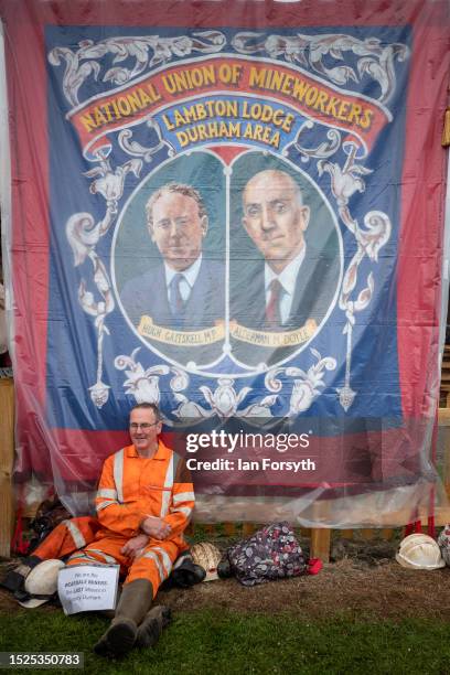 Former miner from Weardale sits next to a banner during the 137th Durham Miners Gala on July 08, 2023 in Durham, England. Hosted by the Durham...