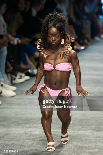 Model walks the runway wearing Naava Swim during Miami Swim Week Powered By Art Hearts Fashion at Fontainebleau Miami Beach on July 07, 2023 in Miami...