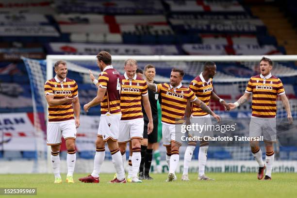 Liam Ridehalgh of Bradford City celebrates with team mates after scoring their sides fourth goal during the Pre-Season Friendly match between Bury FC...