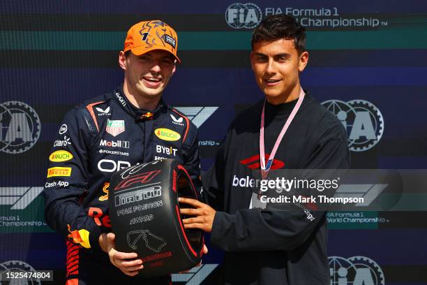 Pole position qualifier Max Verstappen of the Netherlands and Oracle Red Bull Racing is presented with the Pirelli Pole Position award by Paulo...