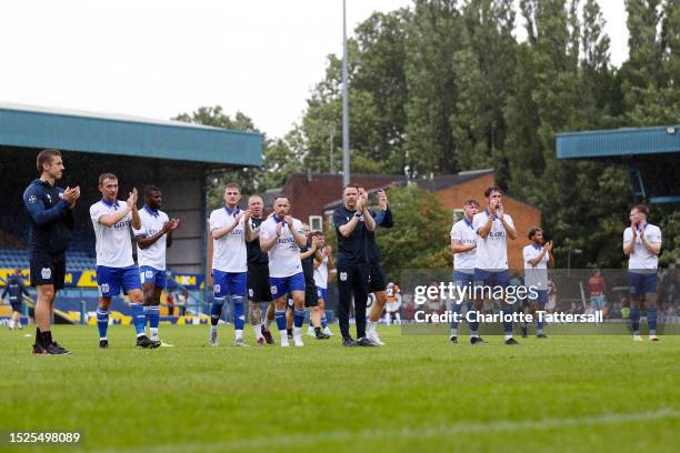 Bury FC applauds fans following the Pre-Season Friendly match between Bury FC and Bradford City at Gigg Lane on July 08, 2023 in Bury, England.