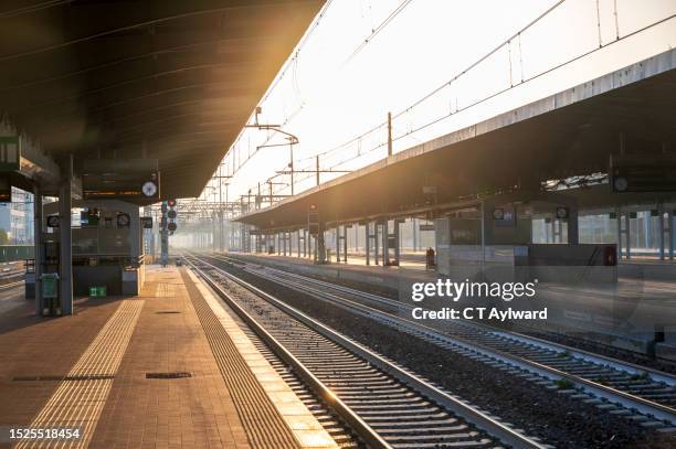 early morning train & sunrise - italian railway station stock pictures, royalty-free photos & images