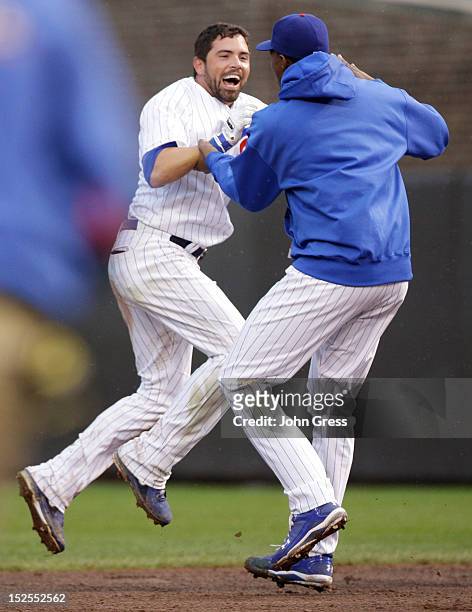 David DeJesus of the Chicago Cubs celebrates with Alberto Cabrera after hitting a walk off RBI single against the St. Louis Cardinals in the 11th...