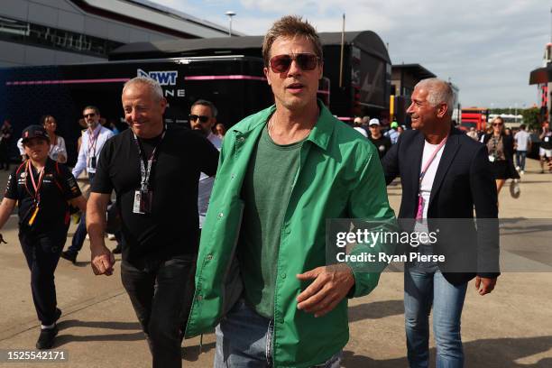 Brad Pitt, star of the upcoming Formula One based movie, Apex, walks in the Paddock after qualifying ahead of the F1 Grand Prix of Great Britain at...