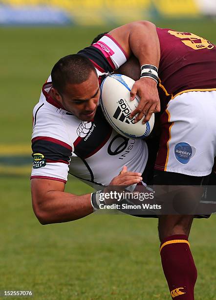 Rudi Wulf of North Harbour is upended in a tackle during the round nine ITM Cup match between North Harbour and Southland at North Harbour Stadium on...