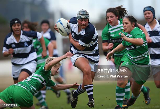Aroha Savage of Auckland is tackled by Wairakau Greig of Manawatu during the round three Women's Provincial Championship match between Auckland and...