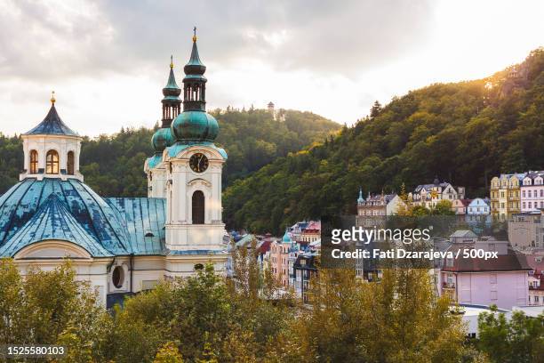 view of church against sky,karlovy vary,czech republic - bohemia czech republic - fotografias e filmes do acervo