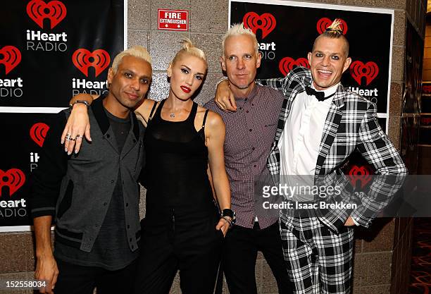 Bassist Tony Kanal, singer Gwen Stefani, guitarist Tom Dumont and drummer Adrian Young of No Doubt appear backstage during the 2012 iHeartRadio Music...