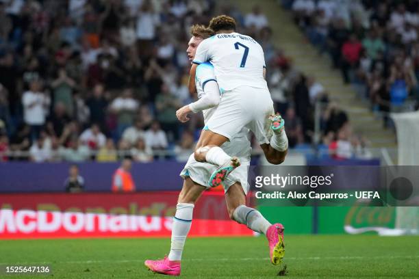 Cole Palmer of England celebrates after scoring their first side goal with his team mate Morgan Gibbs White during the UEFA Under-21 Euro 2023 final...