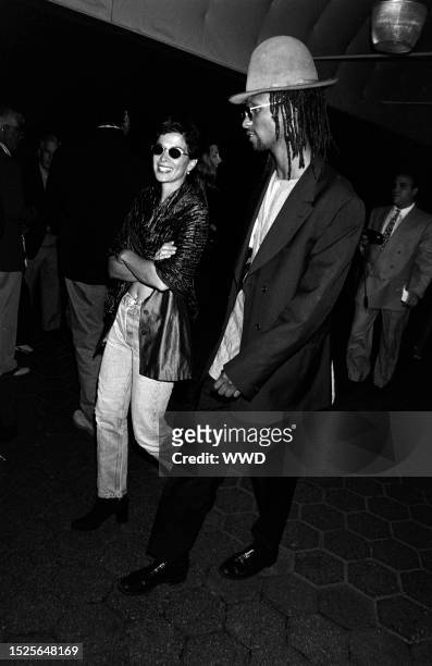 Annabella Sciorra and Majek Fashek attend an event, benefetting the American Foundation for AIDS Research, at Tavern on the Green in New York City on...