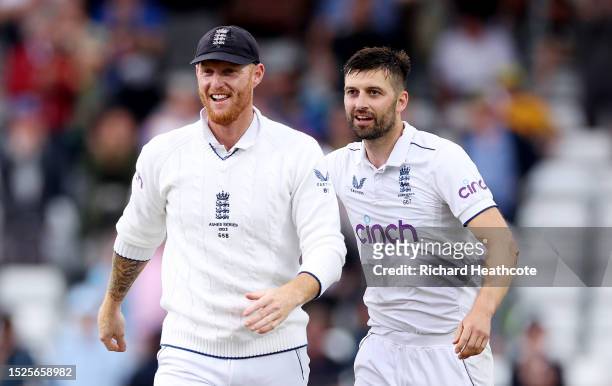 Mark Wood of England celebrates with captain Ben Stokes after dismissing out Mitchell Starc of Australia during Day Three of the LV= Insurance Ashes...