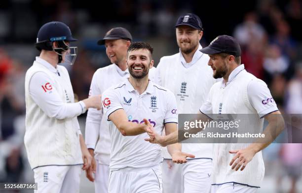Mark Wood of England celebrates with teammates after dismissing Mitchell Starc of Australia during Day Three of the LV= Insurance Ashes 3rd Test...