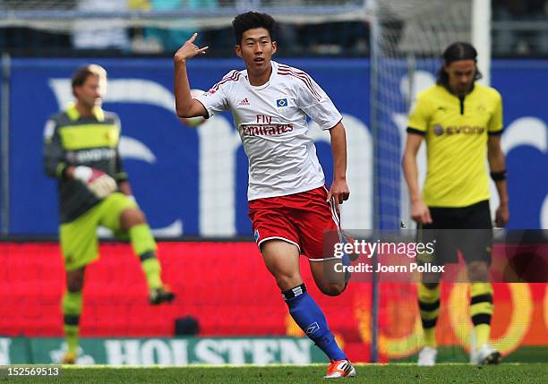 Heung Min Son of Hamburg celebrates after scoring his team's third goal during the Bundesliga match between Hamburger SV and Borussia Dortmund at...