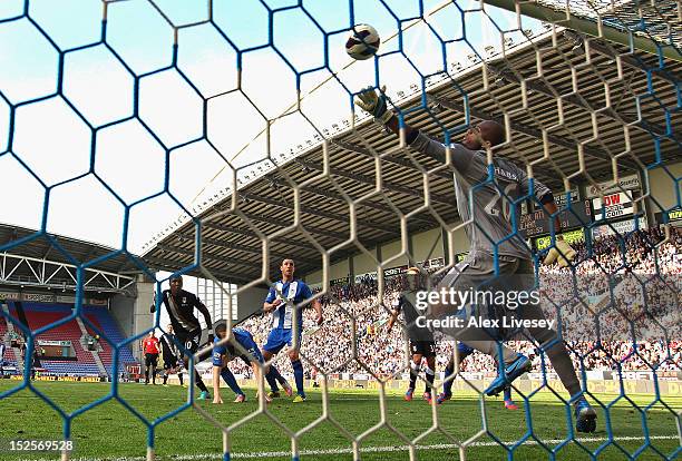 Hugo Rodallega of Fulham scores the opening goal past Ali Al Habsi of Wigan Athletic during the Barclays Premier League match between Wigan Athletic...