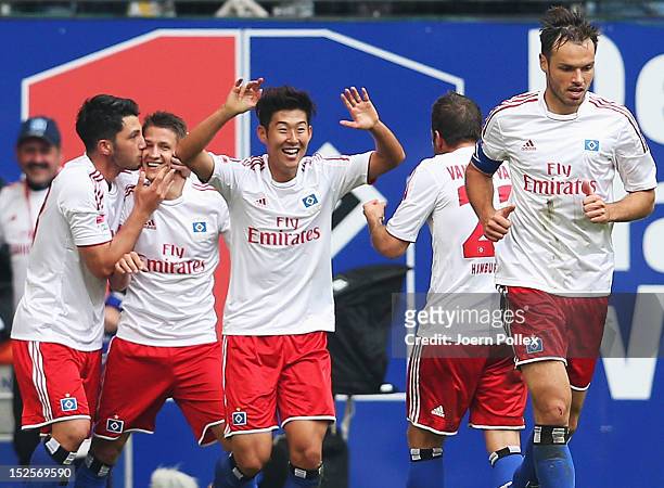 Ivo Ilicevic of Hamburg celebrates with his team mates after scoring his team's second goal during the Bundesliga match between Hamburger SV and...