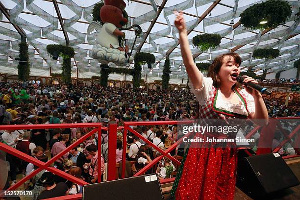 Japan's most famous yodeling singer Sakura Kitagawa yodels during day 1 of Oktoberfest beer festival at Hofbraeuhaus beer tent on September 22, 2012...