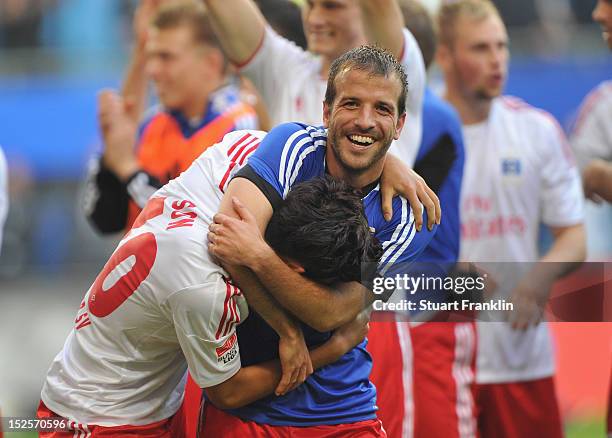 Rafael Van Der Vaart of Hamburg celebrates with double goal scorer Heung Min Son at the end of the Bundesliga match between Hamburger SV and Borussia...