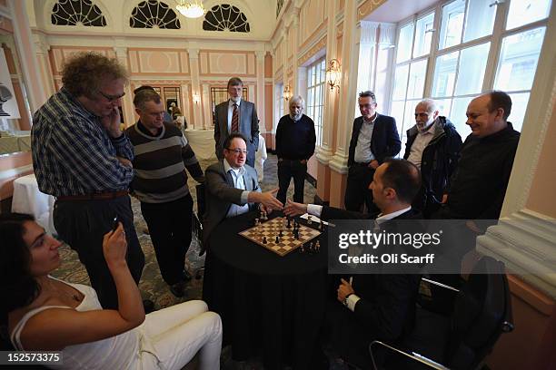 Chess Grandmasters Boris Gelfand and Veselin Topalov analyse their match immediately after its conclusion at the World Chess London Grand Prix at...