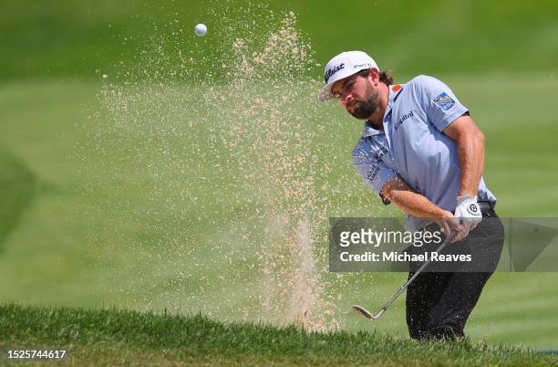Cameron Young of the United States plays a shot from a bunker on the second hole during the third round of the John Deere Classic at TPC Deere Run on...