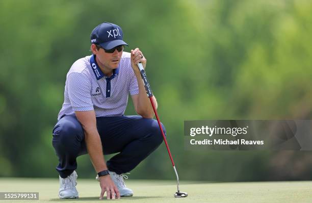 Adam Schenk of the United States lines up a putt on the third green during the third round of the John Deere Classic at TPC Deere Run on July 08,...