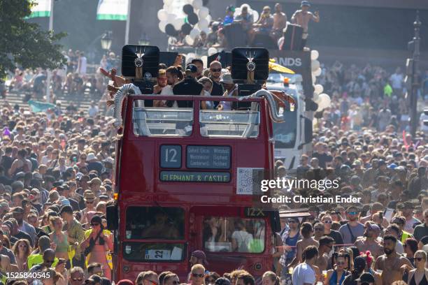 Techno music enthusiasts dance on music trucks during the Rave the Planet parade in Tiergarten park on July 8, 2023 in Berlin, Germany. ÑRave the...