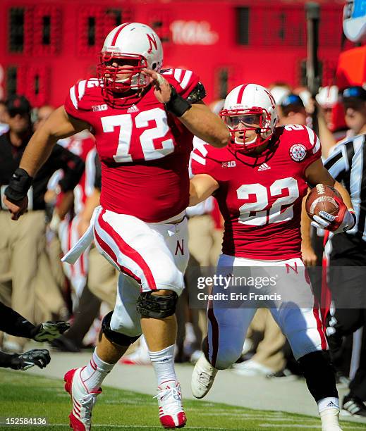 Running back Rex Burkhead of the Nebraska Cornhuskers follows teammate offensive linesman Justin Jackson during their game against the Idaho State...
