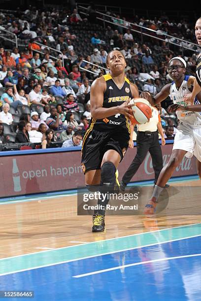 Amber Holt of the Tulsa Shock drives to the basket on September 22, 2012 at the Prudential Center in Newark, New Jersey. NOTE TO USER: User expressly...